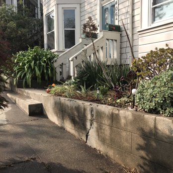 Sixto - a row of planters in front of a house - Gardeners Near Me Sixto - a row of planters in front of a house - Gardeners Near Me