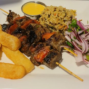 Hamilton's Kitchen - Steak skewers with fried cassava, cilantro wild rice pilaf with cilantro & pickled red onions on the side - New American Near Me - Winter Park, Florida