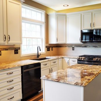 Molyneaux Home - a kitchen with white cabinets and granite countertops - Carpeting Near Me - Verona, Pennsylvania Molyneaux Home - a kitchen with white cabinets and granite countertops - Carpeting Near Me - Verona, Pennsylvania