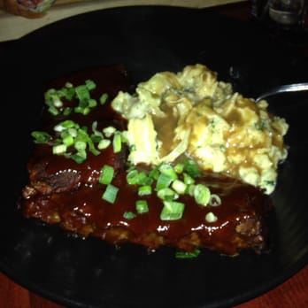 The Local - Full rack of ribs that were fall off the bone delicious and a smashed potato dish that was very good - Burgers Near Me - Victoria, British Columbia