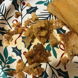 Amazing pork tamale with fresh green chili , with the perfect amount  of masa. I brought it home to try, and as always, it was excellent.