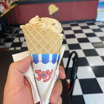 Prince's Parlor - a hand holding a cone of ice cream - Ice Cream & Frozen Yogurt Near Me - Lynchburg, Tennessee