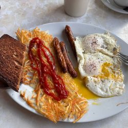 Eggs over easy, hash browns, link sausage, rye toast