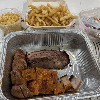 Smoke Queen Barbecue - togo order: 1/2 lb brisket, 1/2 lb siu yuk, 1 sausage, sides of tallow fries and mac and cheese - Barbeque Near Me - Garden Grove, California