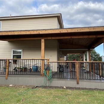 Red Knights Construction - Wraparound deck with natural cedar beams clear coated and composite "cooling" deck floor and skirting. Roof shingles match house. - Decks & Railing Near Me - Cedar Creek, Texas