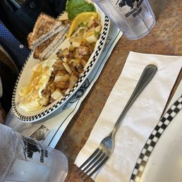 Two eggs with toast and country potatoes
