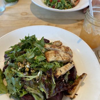 Vinaigrette - The Beet Goes On (foreground) and Ginger Turmeric Tonic, The Omega with shrimp and the Kale Apple Spritz in the background - Salad Near Me - Austin, Texas Vinaigrette - The Beet Goes On (foreground) and Ginger Turmeric Tonic, The Omega with shrimp and the Kale Apple Spritz in the background - Salad Near Me - Austin, Texas