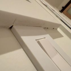 Westside Custom Painting - Bad caulking at window sill and uneven paint.