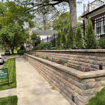 Franklin Brothers Landscape - a stone retaining wall and a car parked on the side of the road - Landscaping Near Me Franklin Brothers Landscape - a stone retaining wall and a car parked on the side of the road - Landscaping Near Me