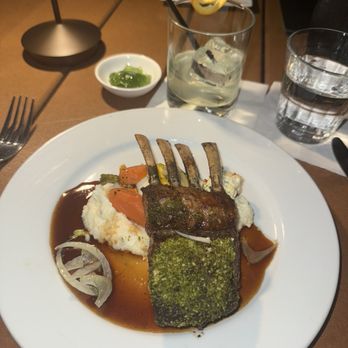 Biga On The Banks - Lamb rack with grits and carrots - New American Near Me - San Antonio, Texas Biga On The Banks - Lamb rack with grits and carrots - New American Near Me - San Antonio, Texas