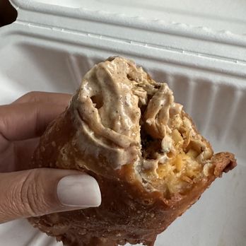 The Empanada Lady - a hand holding a pastry - Empanadas Near Me - Baltimore, Maryland