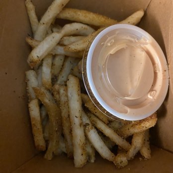 PINCHO - Cajun fries that were well-seasoned but I can't believe they included the sauce container inside the box and atop my fries. - Burgers Near Me - Sunrise, Florida