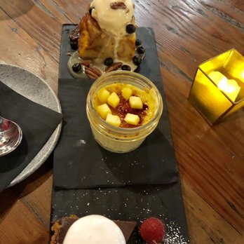Finch - Dessert trio of bread pudding, coconut, pineapple mango creme brûlée and s'mores tart - American Near Me - Wildomar, California Finch - Dessert trio of bread pudding, coconut, pineapple mango creme brûlée and s'mores tart - American Near Me - Wildomar, California