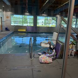 Premier Swim Academy - White chair is for those who aren't able to access the pool on their own