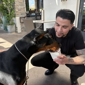 Flecha - Flecha's Tim giving Charley Rozell a delicious pup cup - Mexican Near Me - San Diego, California