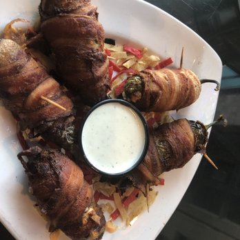 Outlaw Grill - Appetizers. Jalapeños filled with cheese and wrapped by Bacon. Yumm! - American Near Me - Hobbs, New Mexico