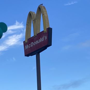 McDonald's - a mcdonald's sign in the foreground - Burgers Near Me - Carolina Beach, North Carolina McDonald's - a mcdonald's sign in the foreground - Burgers Near Me - Carolina Beach, North Carolina