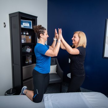 Meg Donnelly - Nova Weekend Warriors - Meg Donnelly, Licensed Massage Therapist & Mobility Coach, a local triathlete, celebrates a local triathletes success with a high five. - Massage Therapy Near Me - Herndon, Virginia Meg Donnelly - Nova Weekend Warriors - Meg Donnelly, Licensed Massage Therapist & Mobility Coach, a local triathlete, celebrates a local triathletes success with a high five. - Massage Therapy Near Me - Herndon, Virginia