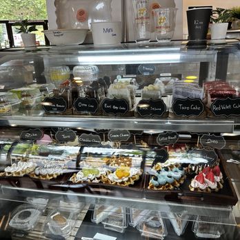 One Bite Cafe - Case with cakes and cheesecakes. All of the GF selections were individually wrapped to prevent contamination - Cafes Near Me - Woodinville, Washington