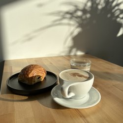 Mundos HQ - Chocolate croissant and dirty chai w/oat milk.