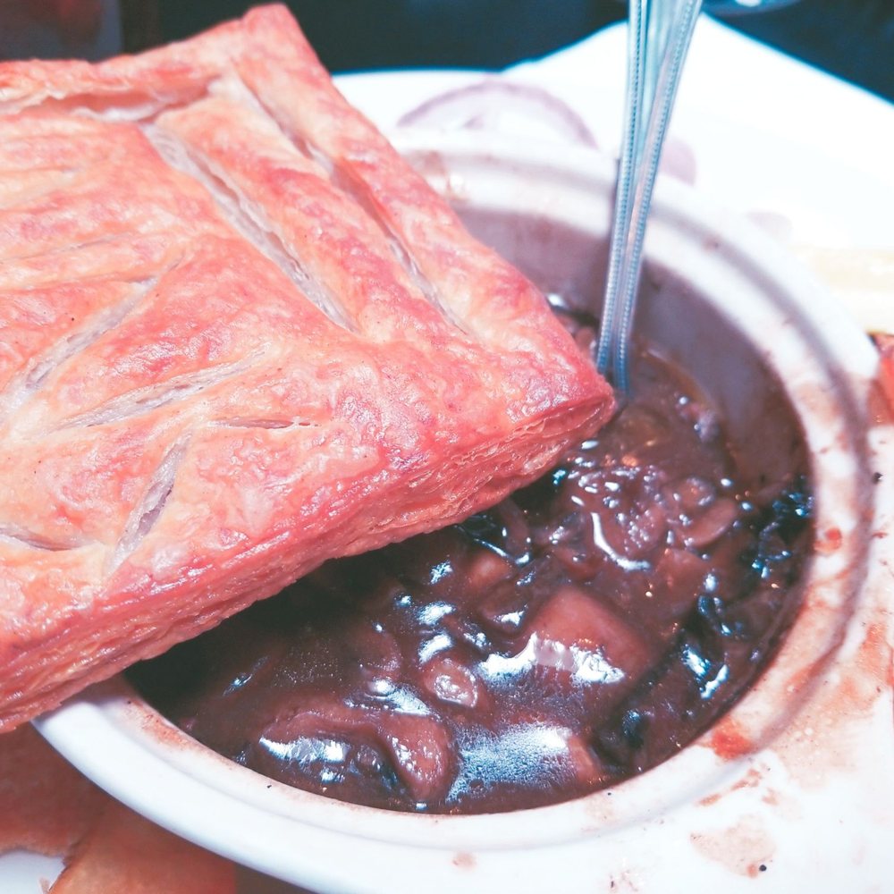 Finn's Irish Pub - Steak and mushroom pie with a square of puff pastry loosely on top for a crust - Gastropubs Near Me - Ellsworth, Maine Finn's Irish Pub - Steak and mushroom pie with a square of puff pastry loosely on top for a crust - Gastropubs Near Me - Ellsworth, Maine