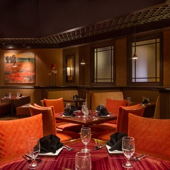 Woodfire Grille - a dining room with orange chairs - Seafood Near Me - Northwood, Iowa Woodfire Grille - a dining room with orange chairs - Seafood Near Me - Northwood, Iowa