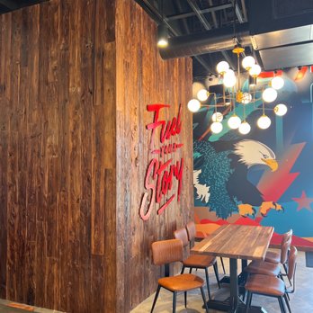 Black Rock Coffee Bar - a table and chairs - Coffee & Tea Near Me - Pasadena, Texas