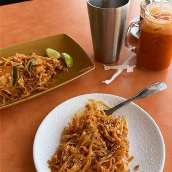 Homey Thai Bistro - A plate of Pad Thai, with a Thai iced tea - Thai Near Me - Concord, California Homey Thai Bistro - A plate of Pad Thai, with a Thai iced tea - Thai Near Me - Concord, California