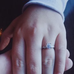 A custom made 1 ct. Oval, set with two pears on the sides from J. Rankin.