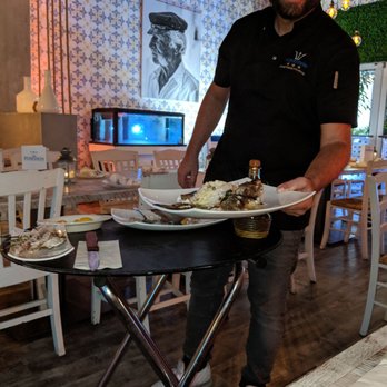 Poseidon - Fresh, whole grilled Sea Bass deboned and served at the table. - Greek Near Me - Miami Beach, Florida Poseidon - Fresh, whole grilled Sea Bass deboned and served at the table. - Greek Near Me - Miami Beach, Florida