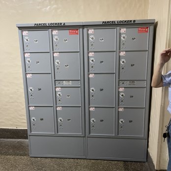 Property Services - a man standing in front of lockers - Property Management Near Me - Valley Stream, New York