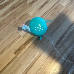 Party City - Dinosaur balloon not properly filled.