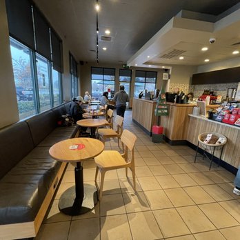 Starbucks - a man standing in a coffee shop - Coffee & Tea Near Me - Slidell, Louisiana