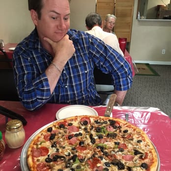 Giovanni's - Awesome supreme pizza!!! The photo bomb by the nosey, little ol lady is cracking me up! Lol - Italian Near Me - Hico, Texas