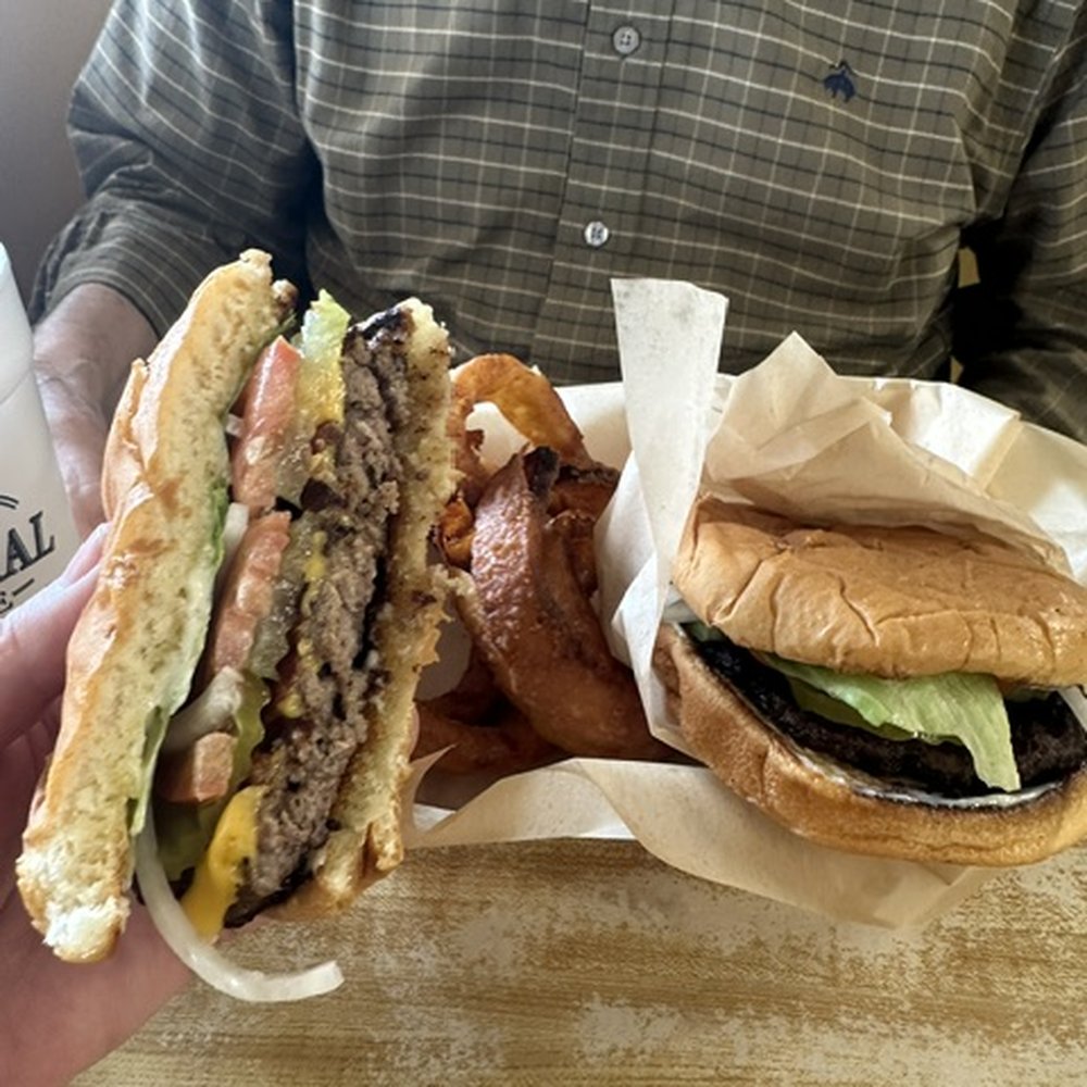 Novice General Store - Check the cross section and beauty of the bacon cheeseburger and hamburger with golden delicious onion rings in the background. - Convenience Stores Near Me - Paris, Texas Novice General Store - Check the cross section and beauty of the bacon cheeseburger and hamburger with golden delicious onion rings in the background. - Convenience Stores Near Me - Paris, Texas