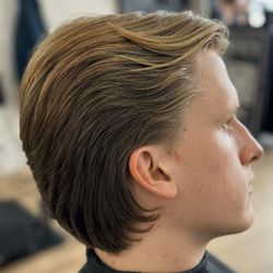 The Dandy Men's Grooming - A stylish blend of medium-length top hair and long back strands.