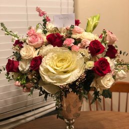Beautiful roses and a white ornamental kale Beautiful roses and a white ornamental kale