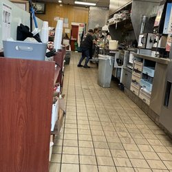 Huddle House - Kitchen area, where this one lady cooks and prepares all the food for hungry guests!  Flipping eggs in a pan, breakfast was delicious!