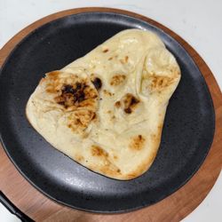 Soft, fluffy Indian flatbread baked in a tandoor.