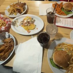 Clockwise: Burger Royale w sweet potato fries, New England Chowder, Animal Burger, Hot Honey Wings, Carnitas Nachos, Savannah Burger