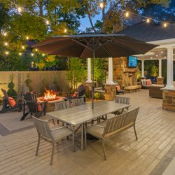 Accent Landscapes - This Broadmoor outdoor living area features a large pavilion, wood burning fireplace, gas fire pit, and ample patio space!
