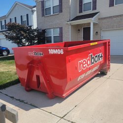 Redbox+ Dumpsters of St Louis Metro East - 10 yard "mini" dumpster on a residential driveway.