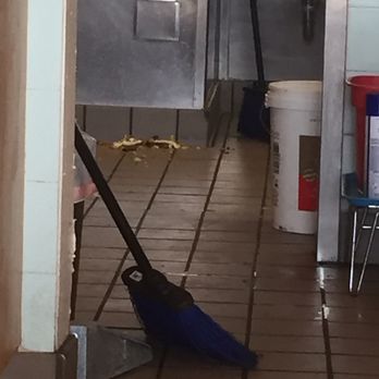 Ono Hawaiian BBQ - Food scraps just sitting there , maybe when the cook is done finishing listening to music or making phone calls he can put it in the trash - Hawaiian Near Me - Downey, California