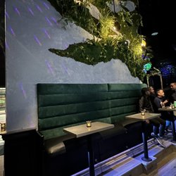 Town Bar and Lounge - Booth seating to snuggle up with your boo!!! AND coat hooks?!?! They thought of everything!!