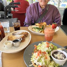 Sandwich, with FRENCH FRIES. AND, Diet Coke. As for GONZALO, Antojito Benedict. AND, Vita Berry Smoothie.  *SHARING Stuffed French Toast.