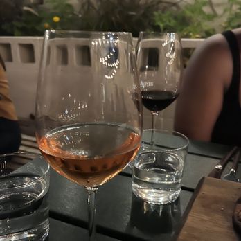 The Library - several glasses of wine on a table - Wine Bars Near Me - Houston, Texas