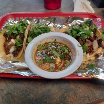 Los Reyes - a plate of tacos and a bowl of soup - Mexican Near Me - Albany, Georgia