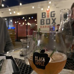a glass of beer on a table a glass of beer on a table