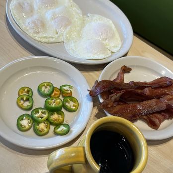 The Toasted Yolk Cafe - Eggs, bacon and jalapeños with black coffee - Breakfast & Brunch Near Me - Conroe, Texas The Toasted Yolk Cafe - Eggs, bacon and jalapeños with black coffee - Breakfast & Brunch Near Me - Conroe, Texas
