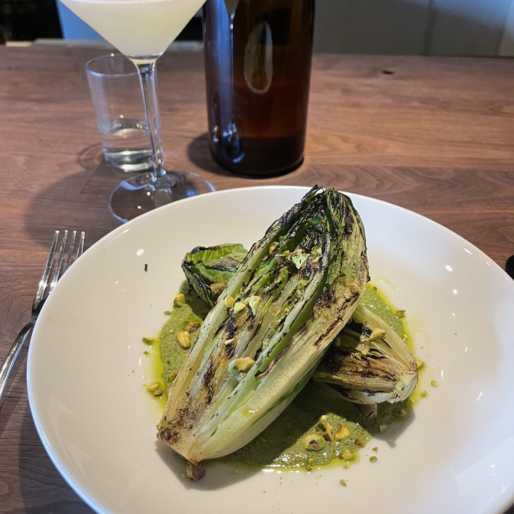Charred Romaine Wedge Who knew a charred romaine could be so good? Green goddess dressing and pistachios. Perfection. Charred Romaine Wedge Who knew a charred romaine could be so good? Green goddess dressing and pistachios. Perfection.